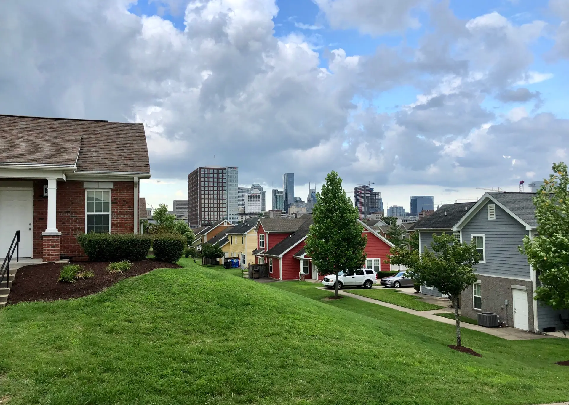 neighborhood showing concept of easements with city skyline in the background